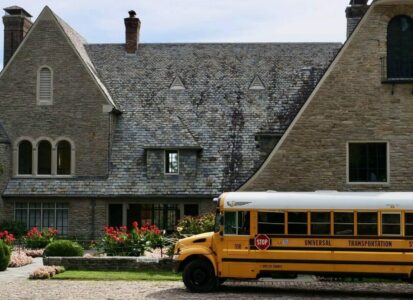 school bus in front of arts center